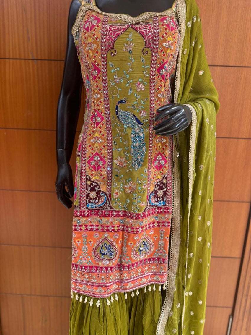 Colorful embroidered traditional outfit on a mannequin against a wooden background